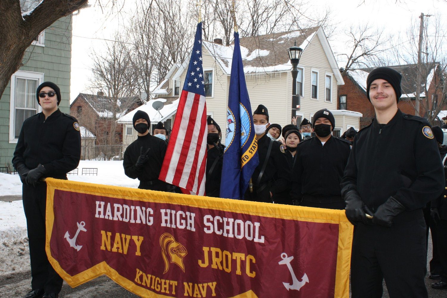 IMG_0843+(2) Harding High School Navy JROTC members holding flags outdoors in winter.
